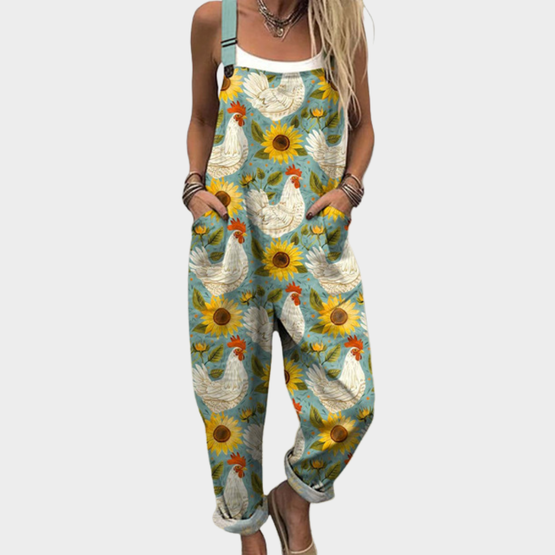 Elodie soft blue overalls with vibrant golden sunflower print