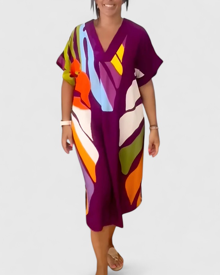 Delphine palm leaf print midi dress worn in a sunlit outdoor environment