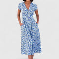 Vivian midi dress highlighting its subtle sweetheart neckline and soft flared skirt