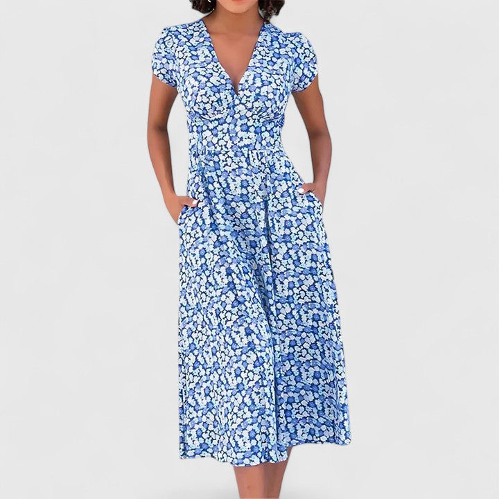 Vivian midi dress highlighting its subtle sweetheart neckline and soft flared skirt