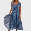 Aubrielle midi dress in motion demonstrating the graceful movement of the swirl print skirt