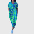 Ashley wrap-style floral dress draped softly in a warm-weather setting
