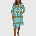 Daisy radiant spring dress styled with boots for a versatile transition-weather outfit