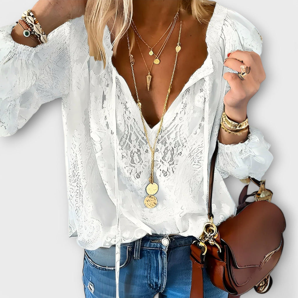 Maëlle bohemian lace tie-neck blouse showing puff sleeves and lace trim