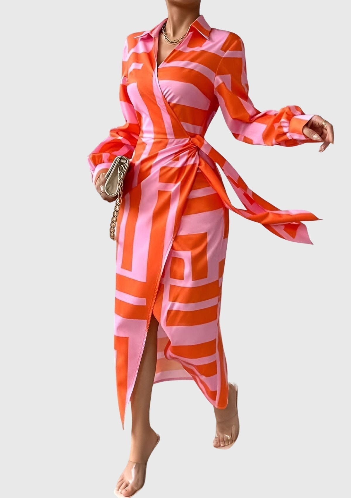 Woman wearing the Everly printed wrap dress showing the adjustable waist tie and collar detail
