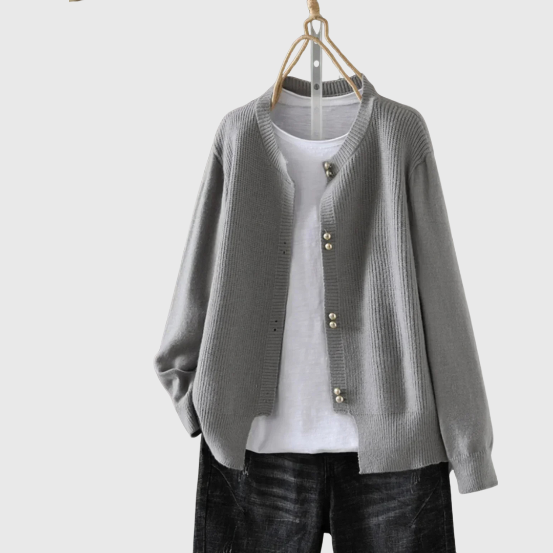 Auri pearl-button crewneck cardigan styled over a simple top