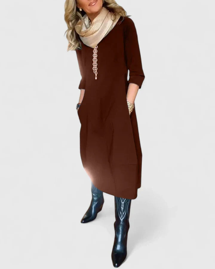 Model wearing the Natalia relaxed crewneck midi dress in a comfortable everyday setting