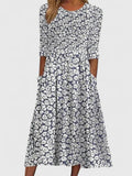 Violethia Floral Pocket Midi Dress featuring vibrant floral print and discreet side pockets