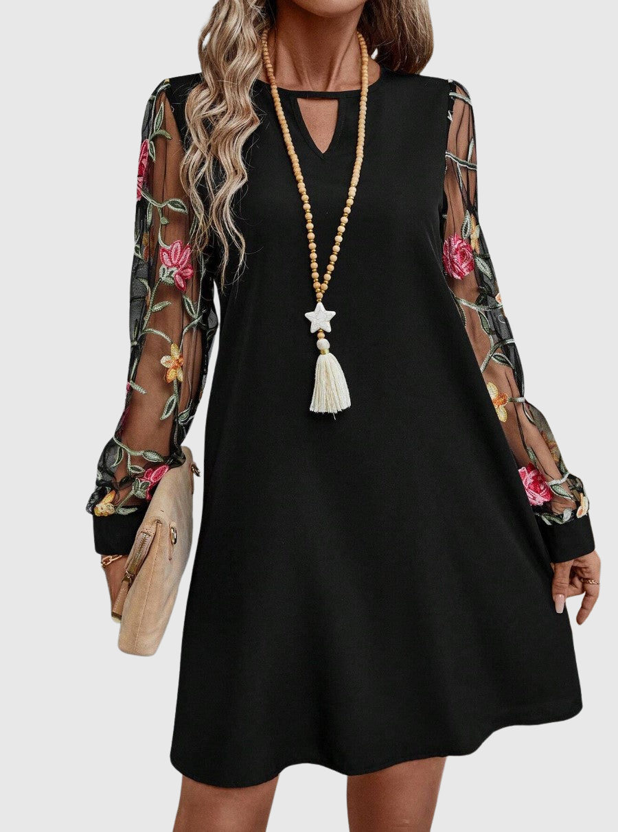 Jolene floral mini dress highlighting the sheer sleeve details and romantic print