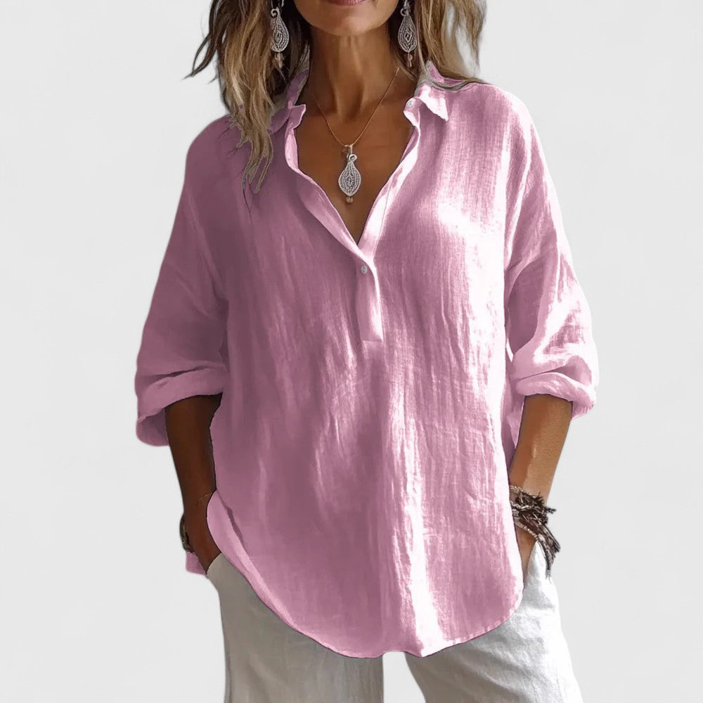 Élise breathable V-neck blouse showing convertible roll-tab sleeves