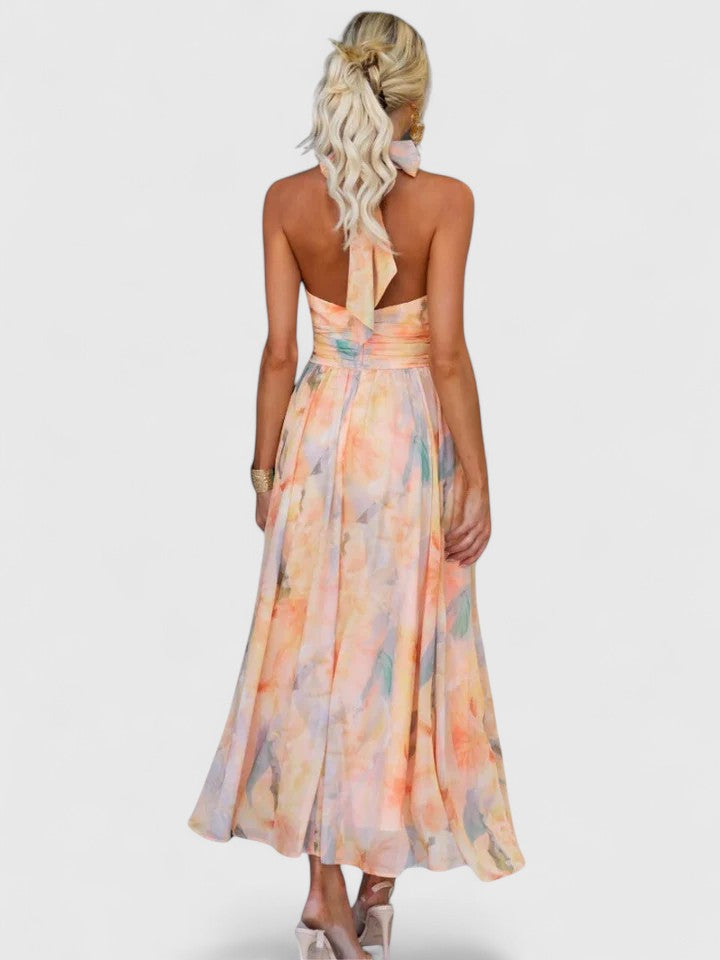 Valerie halter neck midi dress flowing in the wind showing its breezy, romantic silhouette
