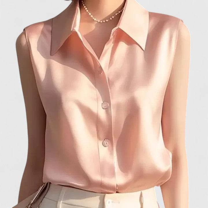 Manon sleeveless satin front-pleat blouse displaying subtle satin sheen