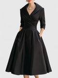 Full-length view of the stylish Vivienne midi dress highlighting its structured fit and functional pockets