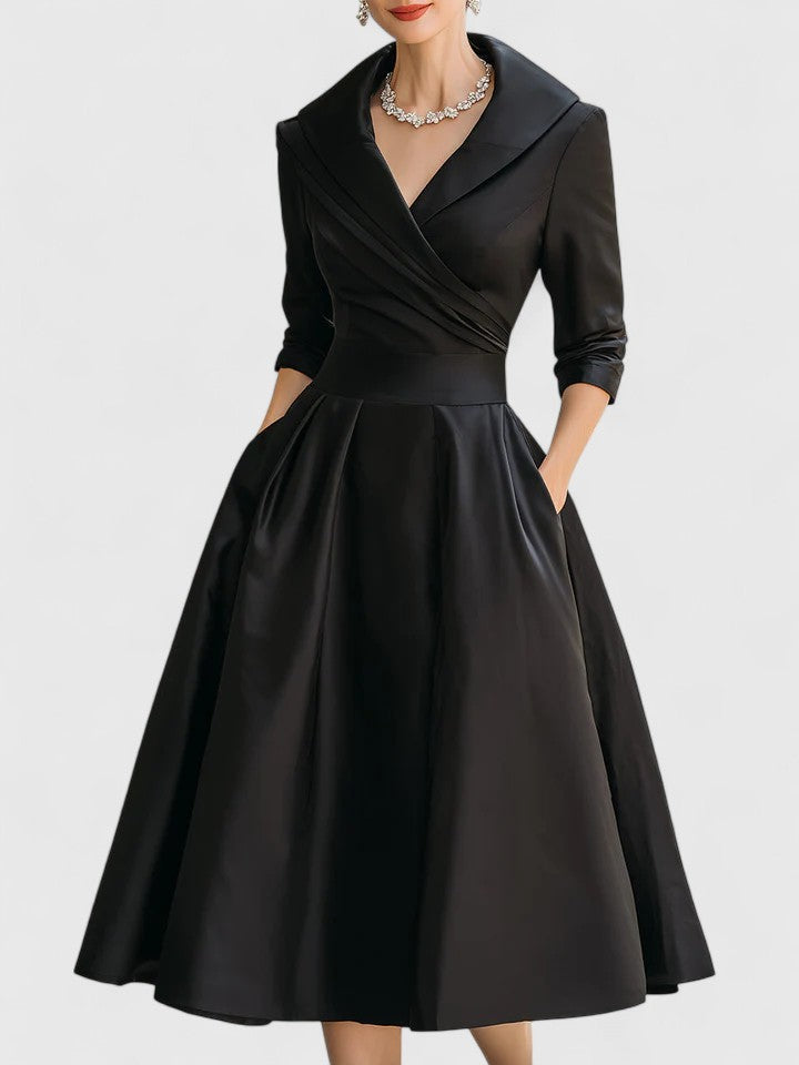 Full-length view of the stylish Vivienne midi dress highlighting its structured fit and functional pockets