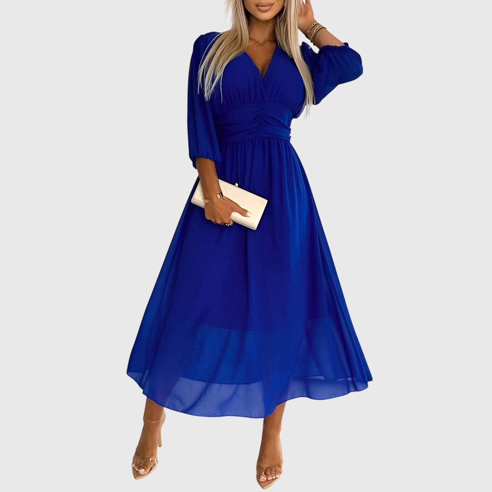 Woman wearing the light and elegant Penelope silk chiffon dress in a breezy setting