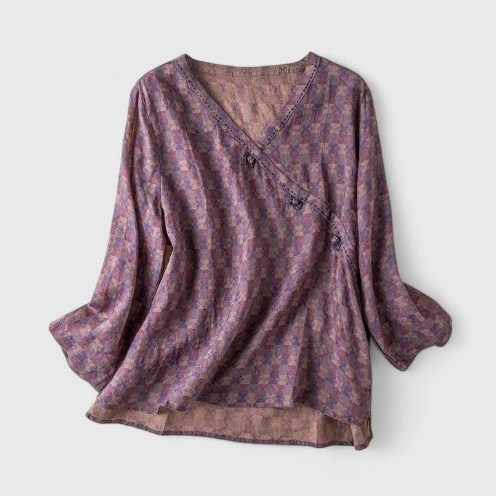 Clémence botanical embroidered blouse showing mother-of-pearl buttons