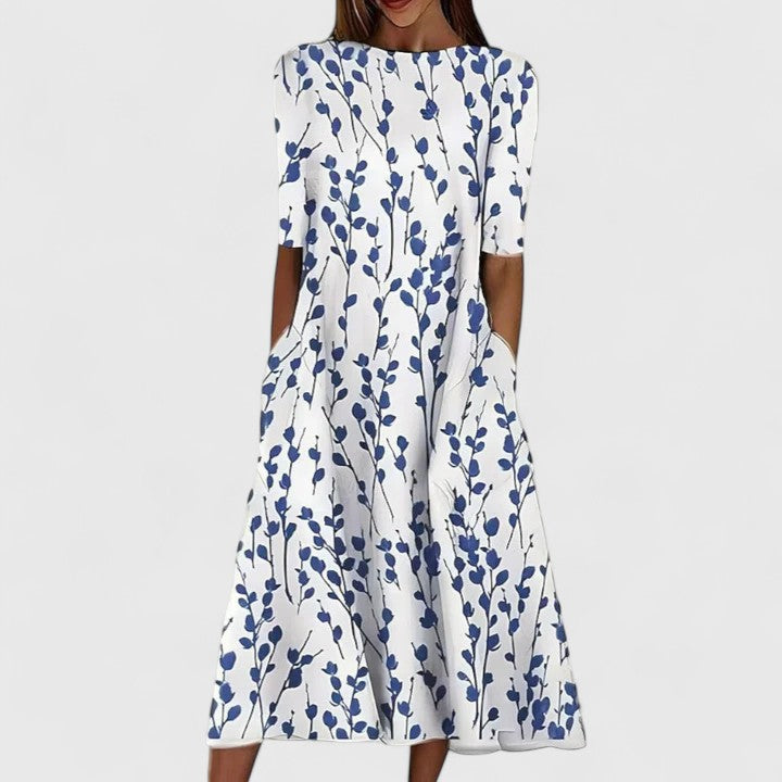 Close-up of the coastal floral pattern and round neckline on the Hannah midi dress