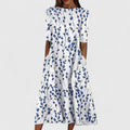 Close-up of the coastal floral pattern and round neckline on the Hannah midi dress