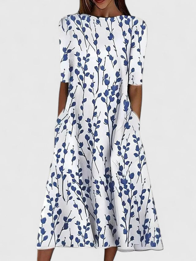 Bright floral print on the Karina midi dress styled for a sunny outdoor setting