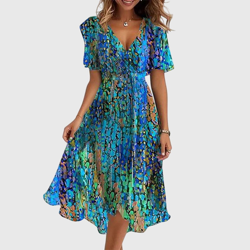 Catalina wrap-style midi dress highlighting its flutter sleeves and fluid hem