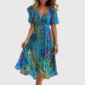 Catalina wrap-style midi dress highlighting its flutter sleeves and fluid hem