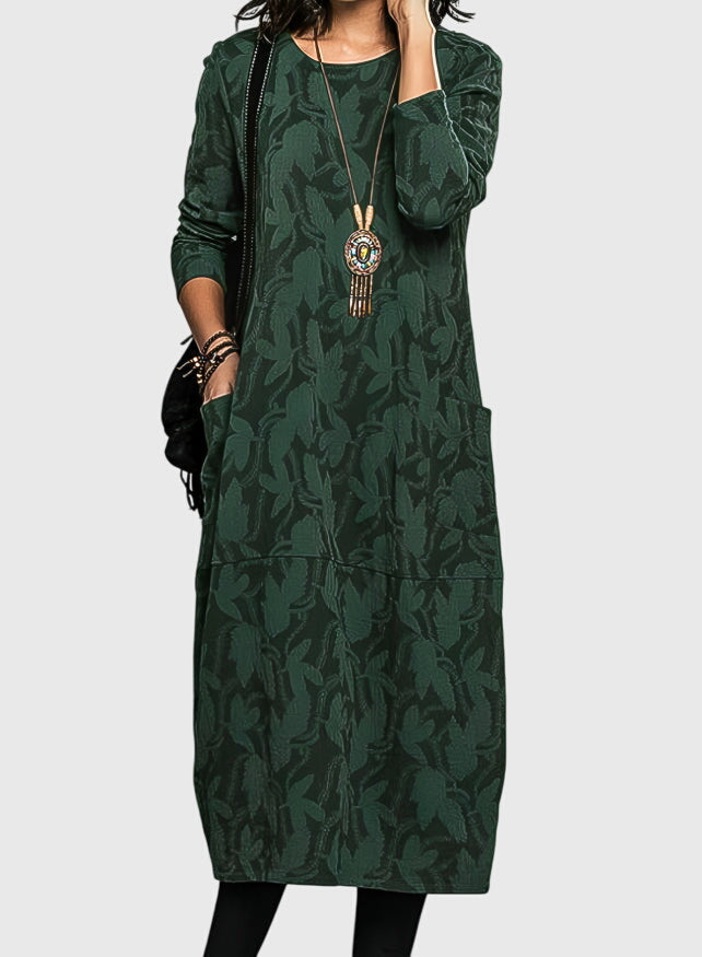 Victoria casual round-neck dress with subtle floral details and functional side pockets