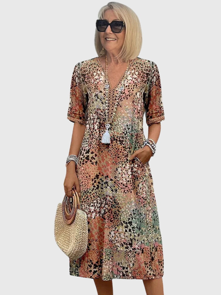 Front view of the Violet floral midi dress showing off its colorful pattern and midi length