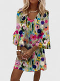 Model wearing the playful Clarissa romantic floral mini dress with a V-neckline