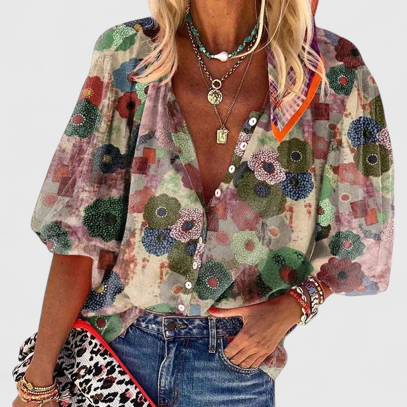 Claire convertible button-placket floral blouse draped over trousers
