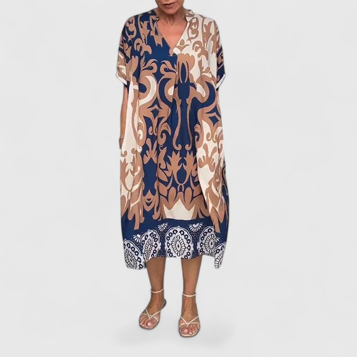 Detailed view of the colorful intricate pattern on the Calanthe V-neck dress