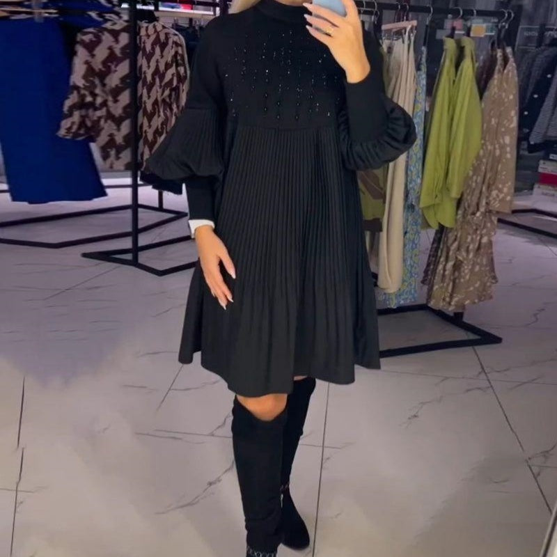 Front view of the Vivienne midi dress highlighting its delicate pleats and flattering fit